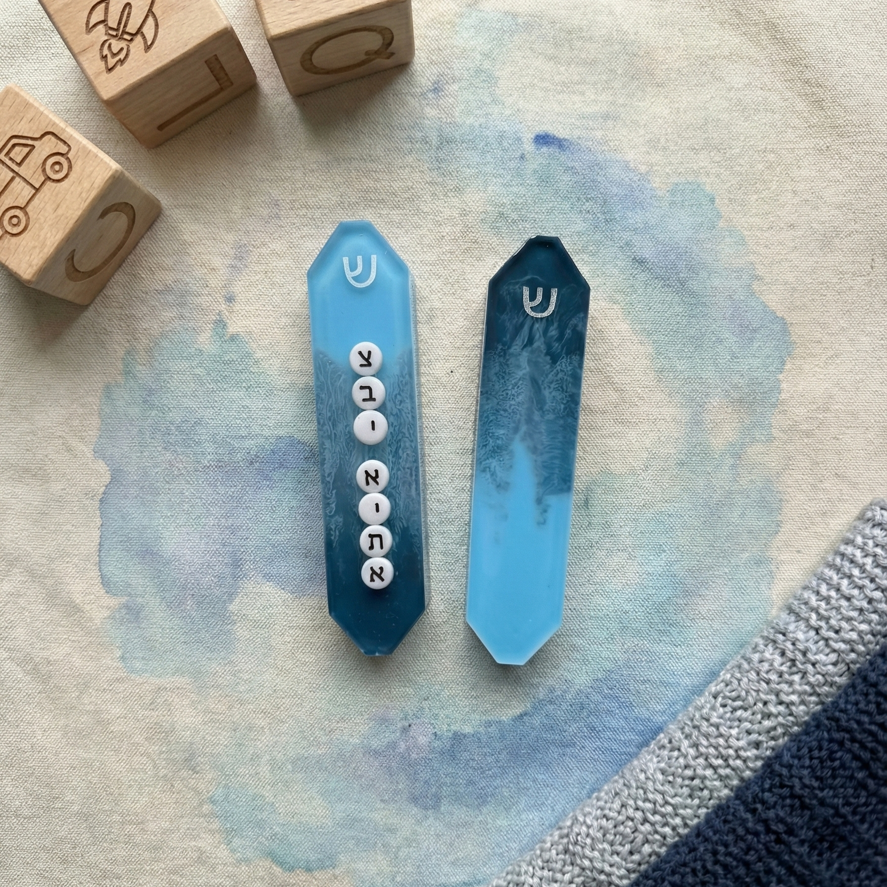 two personalized powder dark blue and white mezuzahs